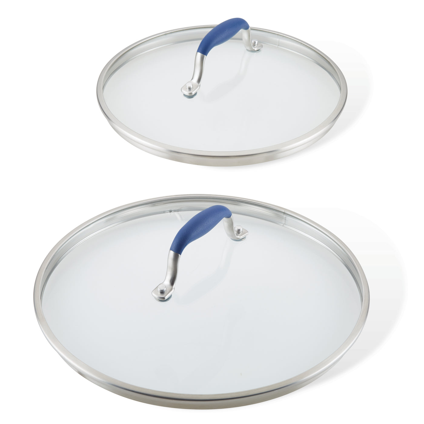 Two lids from the Advanced Home Lid Set, featuring glass with stainless steel edges and SureGrip® blue handles, are displayed. The replacement lids vary in size, with the smaller resting on top of the larger one. Both are shown from above against a plain white background.