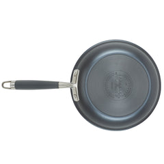 An 11-piece cookware set from Advanced Home includes a non-stick frying pan made of hard anodized aluminum, featuring a black surface and a silver handle when viewed from above. This essential kitchen item boasts a circular base with the Advanced Home brand markings, combining style and functionality for your cooking needs.