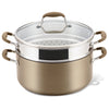 An 8.5-quart Advanced Home beige nonstick stockpot with two handles is neatly stacked with a stainless steel multi-function insert and paired with a glass lid, all arranged on a pristine white background.