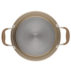 Top view of a round, gray hard-anodized frying pan with brown handles on either side. The slightly reflective, nonstick surface makes it a perfect complement to the Round Two Step Meal Set from Advanced Home. The brand name is embossed on the bottom for an elegant touch.