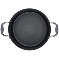 A top-down view of the Advanced Home 10-Quart Stockpot, featuring its wide, black non-stick design with two gray handles on either side, highlights its excellent heat distribution. The interior is smooth and evenly coated.