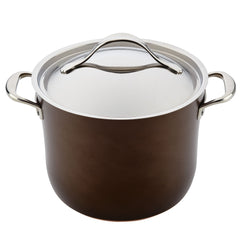 The 11-Piece Cookware Set from Nouvelle Luxe includes a large, dark brown pot made from ultra-durable hard-anodized aluminum, featuring a shiny silver lid and two side handles. The pot has a smooth finish with a polished metallic rim around the lid, offering outstanding copper performance in the kitchen.