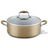 The Advanced Home 7.5-Quart Stockpot is a large, round, golden-brown pot with excellent heat distribution and features a glass lid. It includes two side handles and a matching handle on the lid for easy maneuvering.