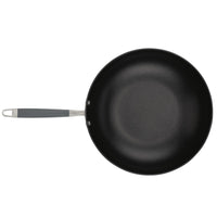 The 12-Inch Stir Fry pan by Advanced Home showcases an Infinity Slide nonstick surface and a gray handle, viewed from above against a pristine white background. Its hard-anodized construction ensures durability and exceptional cooking performance for your culinary creations.
