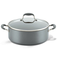 The Advanced Home 7.5-Quart Stockpot is a large gray, nonstick pot featuring excellent heat distribution. It boasts a modern yet simple design with two side handles and a transparent glass lid that includes a central knob for easy lifting.