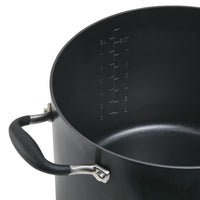 The Advanced Home 10-Quart Stockpot is displayed, showcasing a wide base with a stylish black finish and an ergonomic handle. It includes detailed measurement markings for both liters and quarts, spanning from 2 to 8, to help you achieve perfect portions every time. The pot's nonstick surface ensures effortless cleaning and superior heat distribution.