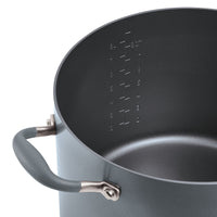 Introducing the Advanced Home 10-Quart Stockpot, featuring a spacious black interior and sturdy metal handles. Inside, it offers convenient embossed measurements in both quarts and liters for easy reading. Enjoy superior heat distribution with its smooth nonstick surface, making it ideal for a wide range of cooking tasks.