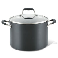 Introducing the 10-Quart Stockpot by Advanced Home: This spacious, dark gray stockpot features a glass lid with a metal rim and comfortable side handles with black grips. It ensures excellent heat distribution, making it ideal for cooking soups, stews, and other large meals.