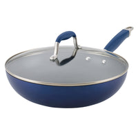 The Advanced 12-Inch Covered Ultimate Pan features a blue nonstick finish, matching handle, and a transparent glass lid with a metal rim and handle, ideal for one-pan meals. Shown on a white background.