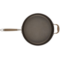 The Advanced Home 5-Quart Sauté Pan with Helper Handle boasts a nonstick frying surface and includes a long handle along with a small grip for added convenience. Its smooth, dark cooking surface is perfect for versatile kitchen tasks, and it comes equipped with a glass lid to help retain moisture and enhance flavor during cooking.