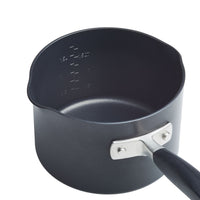 The 2-Quart Straining Saucepan from Advanced Home is a black, hard-anodized saucepan featuring a silver handle and a non-stick interior for lasting durability. It offers convenient measurement markings in cups and milliliters on the inside, making it both practical and efficient.