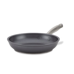 An 8-Inch Frying Pan from Accolade, made of hard-anodized aluminum, with a non-stick surface and a silver handle, is displayed on a white background. Its smooth, round shape and flat bottom make it perfect for cooking on an induction stove.