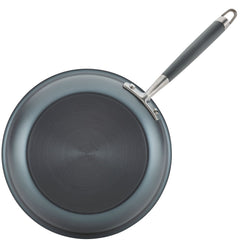 The image displays an essential piece from Advanced Home's 11-Piece Cookware Set: a non-stick frying pan crafted from hard anodized aluminum. Seen from above, it showcases its smooth, dark circular cooking surface and a long handle. The handle features a metallic finish with an ergonomic grip and includes a hole for easy hanging.