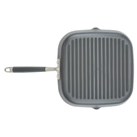 The image displays the Advanced Home 11-Inch Deep Square Grill Pan, featuring a gray color and ridges. It includes a nonstick finish, riveted black handle, and pouring spouts on two sides, all seen from a top-down perspective against a white background.