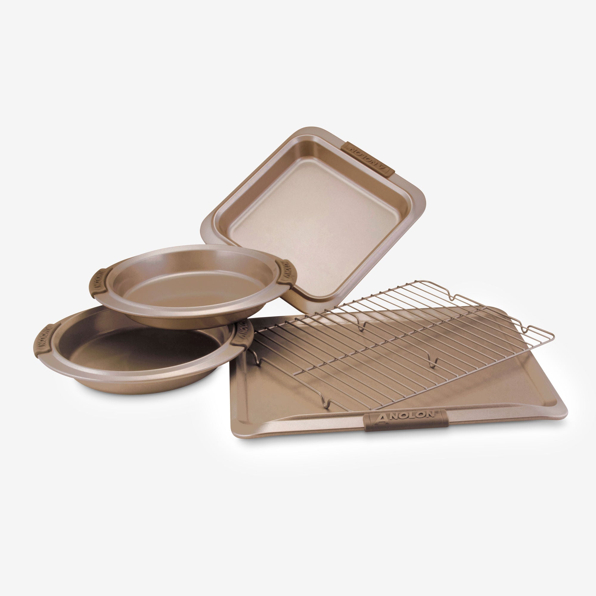 Introducing the Advanced 5-Piece Bakeware Set, featuring a collection of five golden-brown pans and racks. This set includes two round cake pans ideal for baking banana nut bread, a rectangular pan perfect for bar cookies, along with a cooling rack and a baking sheet. All pieces are elegantly displayed on a light surface.