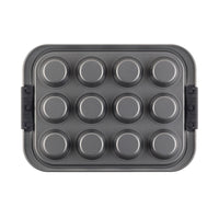 A top view of the Muffin Pan with Lid by Advanced reveals its heavy gauge steel construction. This nonstick, metallic rectangular pan features a secure snap-on cover, perfectly designed for baking and transporting twelve cupcakes or muffins with ease.