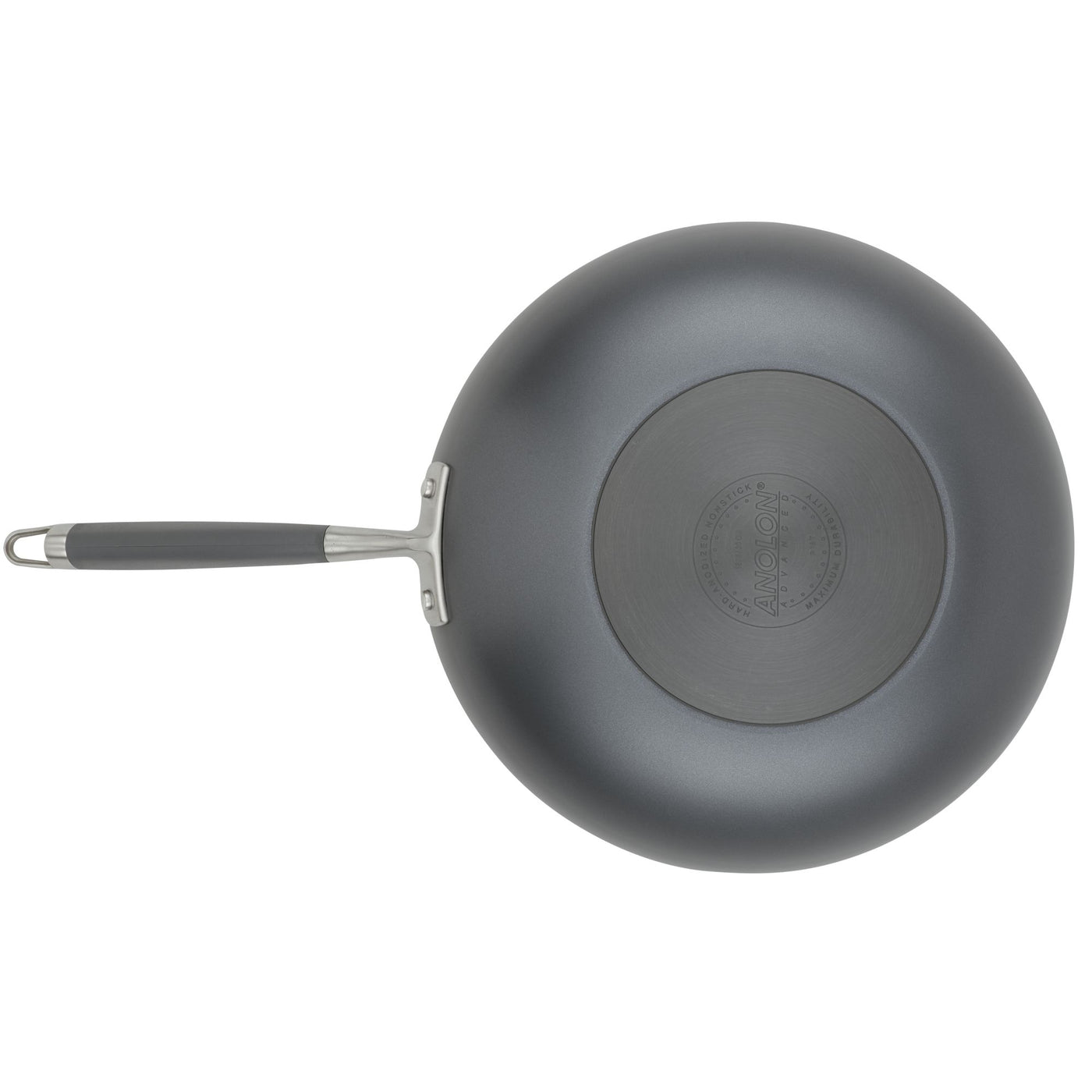 A top-down view of the Advanced Home 12-Inch Stir Fry pan with a metal handle highlights its black, circular patterned bottom. The Infinity Slide nonstick coating guarantees effortless cooking. Centrally embossed with the brand name, this hard-anodized frying pan is a kitchen essential.
