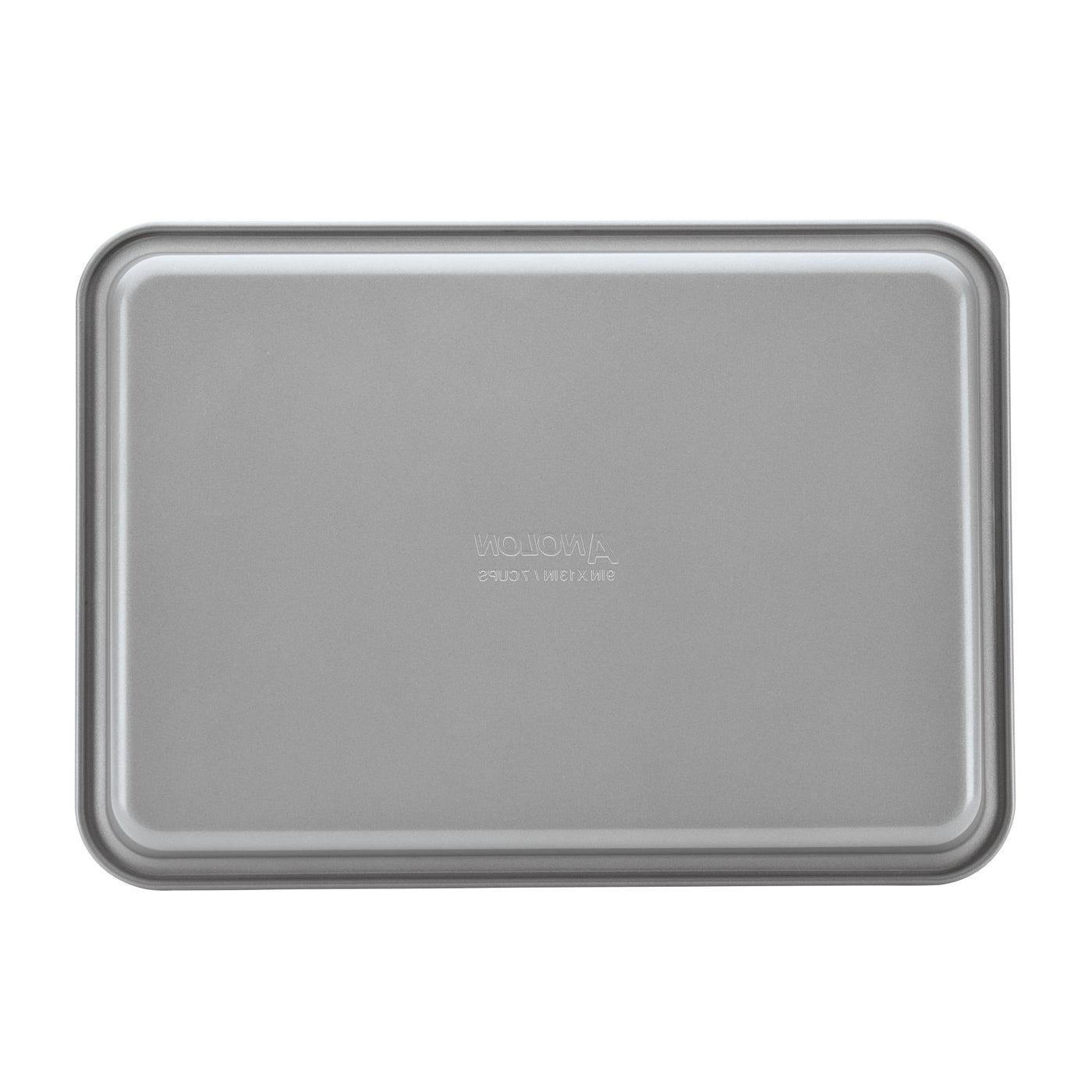 Introducing the 3-Piece Gourmet Cookie Pan Set by Gourmet, featuring rectangular, gray pans with a slightly raised edge. Each pan boasts a smooth, reflective surface that ensures a nonstick finish, making it perfect for baking homemade cookies or roasting savory dishes.