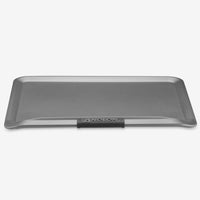 The Advanced 14 x 16-Inch Cookie Sheet with Silicone Grips features raised edges and a black silicone-handled front labeled ANOLON, designed for even heat distribution and shown against a plain white background.