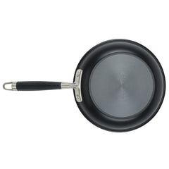 The 11-Piece Cookware Set from Advanced Home includes a non-stick frying pan, an essential piece for your kitchen collection. It features a black handle with silver accents on the base and is crafted from hard anodized aluminum, offering a flat, smooth surface and sturdy construction. The top view showcases its circular shape and sleek handle design.