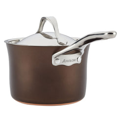 The Nouvelle Luxe saucepan, part of the 11-Piece Cookware Set, features a brown finish with a shiny silver handle and lid made from hard-anodized aluminum. Its nonstick surfaces ensure effortless cooking, while the curved handle on the lid adds a touch of elegance. This piece skillfully combines style and practicality.